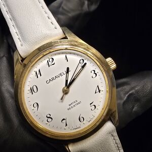 70's Caravelle by Bulova Classic Gold Tone Watch with White Dial & White Strap